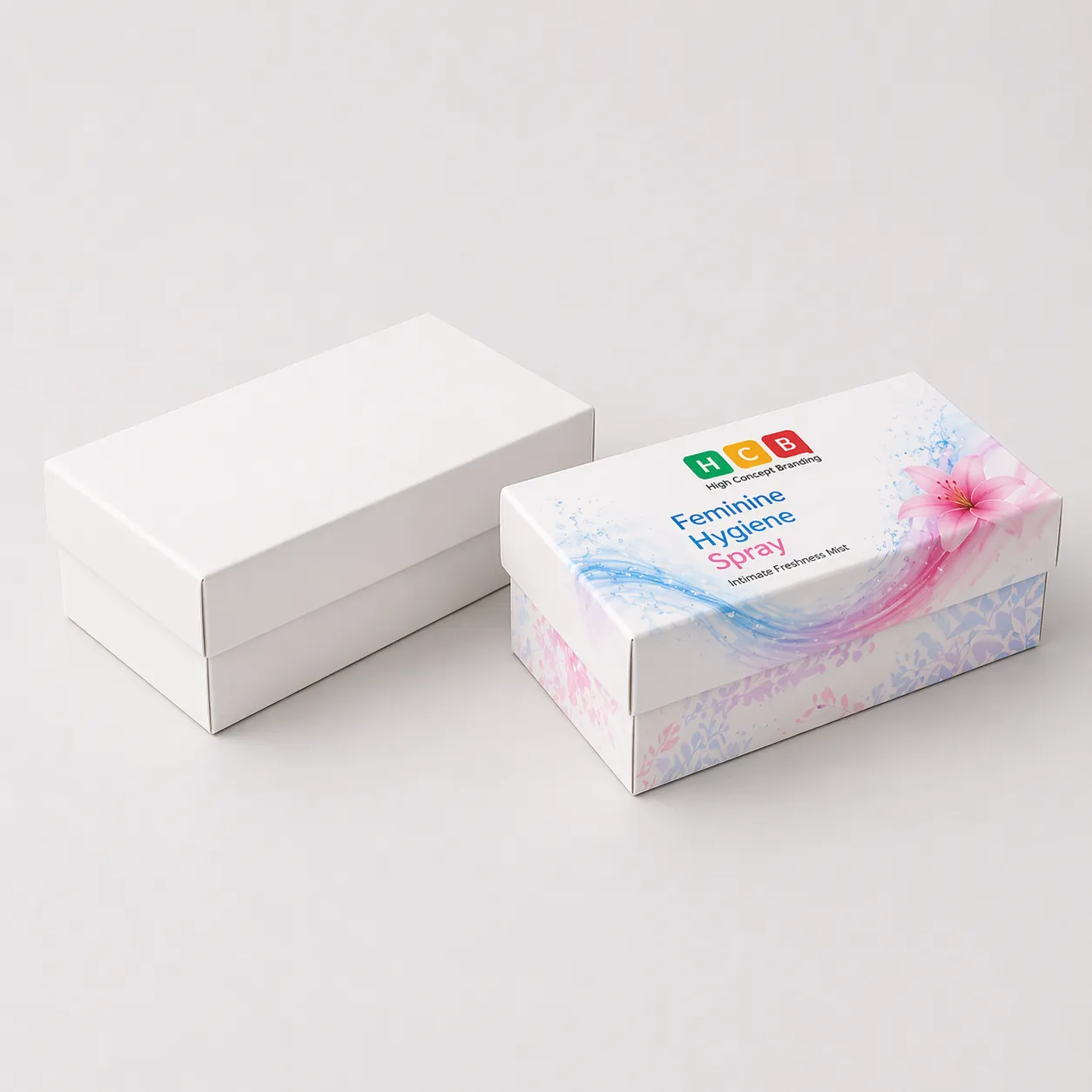 Two vertical cardboard boxes, one plain white and one with blue floral hygiene spray branding. class=